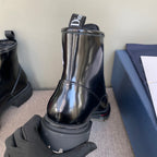 Black unisex leather ankle boot with Dior logo, heel tab, and platform lug sole