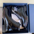 Black unisex leather lace-up ankle boots with Dior logo and chunky rubber soles