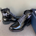 Black unisex leather lace-up ankle boots with Dior logo and chunky rubber soles