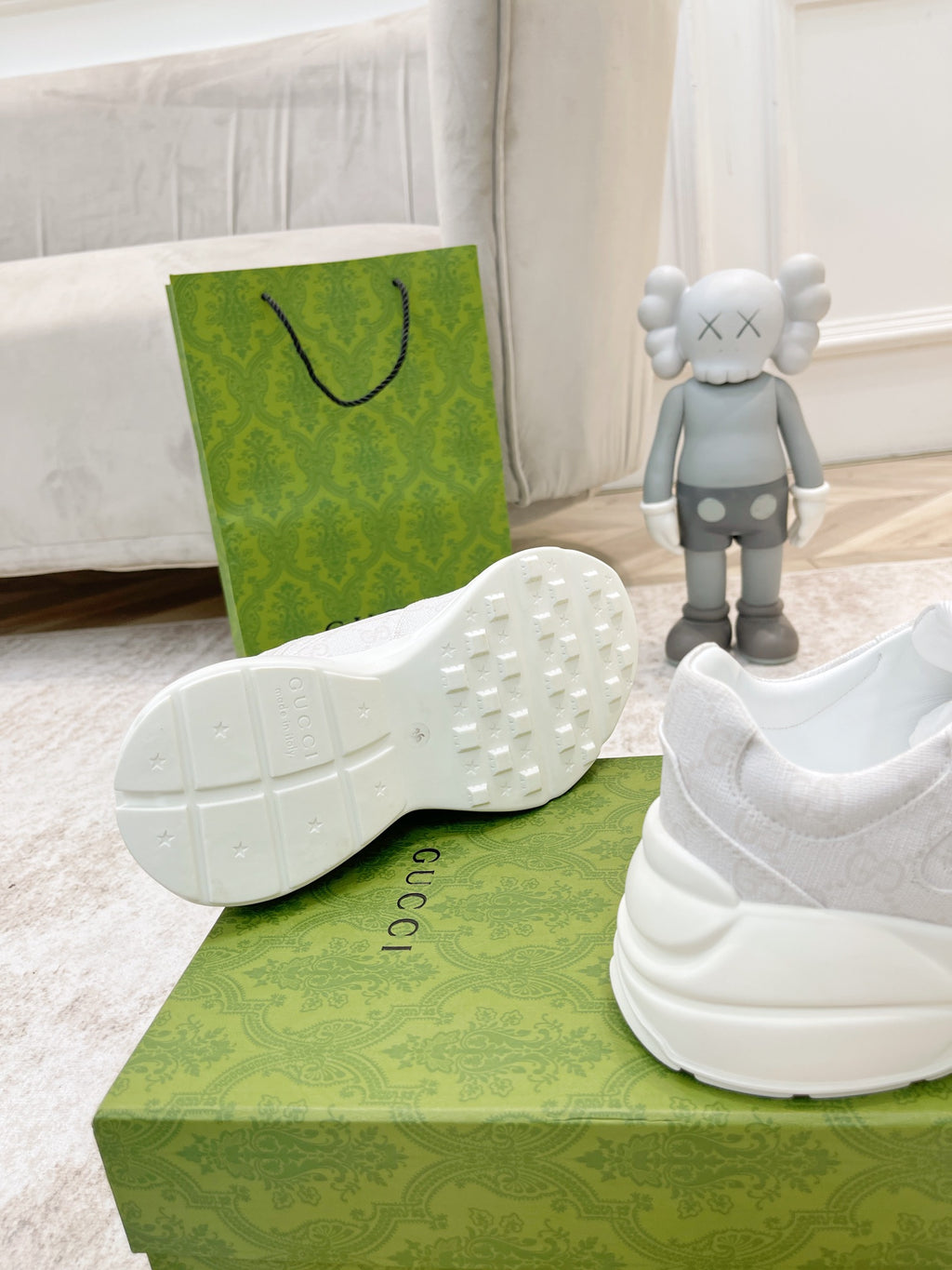White Gucci sneaker outsole and heel view with tread pattern visible