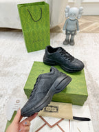 Gucci unisex sneakers, dark gray, front pair on box with lace-up details
