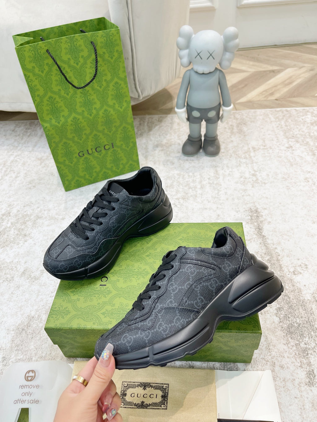 Gucci unisex sneakers, dark gray, angled side view with lace-up upper