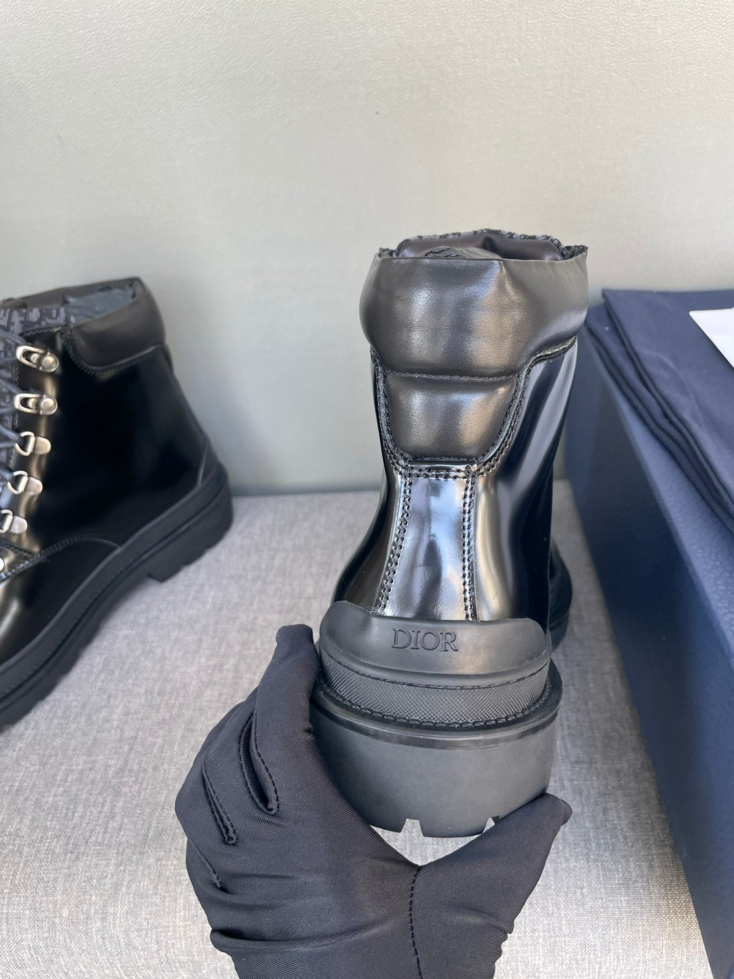 Black lace-up ankle boots with Dior logo on the back heel pull-tab
