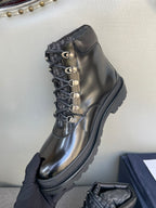 Black lace-up ankle boot with metal eyelets and pull-tab collar detail