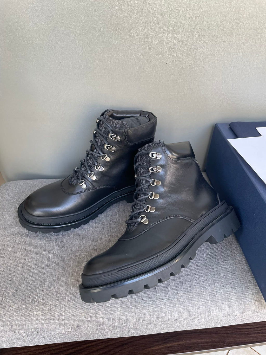 Dark leather lace-up boots with padded collars and chunky rubber soles, Dior