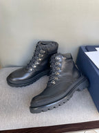 Dark leather lace-up boots with padded collars and chunky rubber soles, Dior