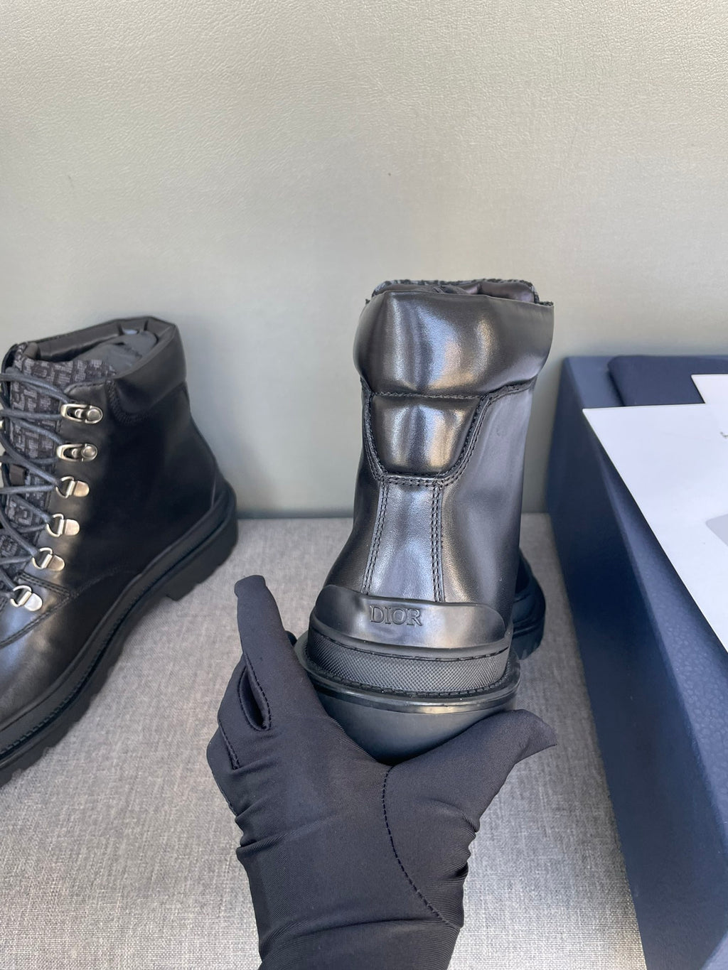 Dior dark leather lace-up boot with logo panel and cushioned collar, thick sole