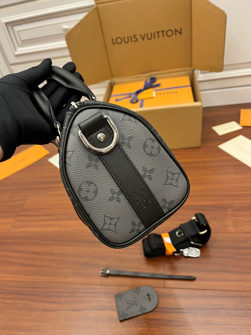 Men's Louis Vuitton monogram mini bag with top handle, dark gray, round detail