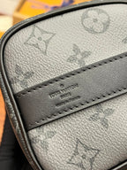 Men's Louis Vuitton monogram bag close-up of logo leather patch and stitching