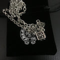 Silver-tone chain necklace with square and circular charm pendants