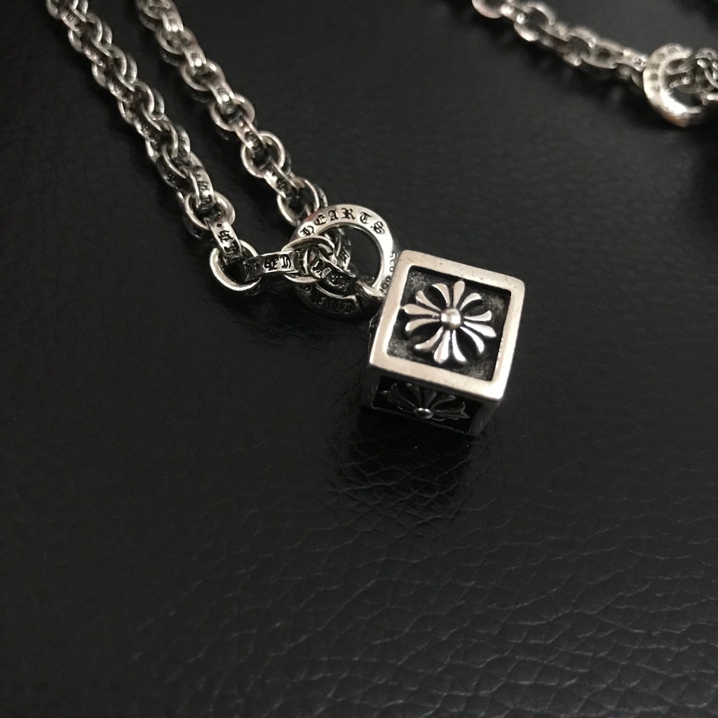 Silver-tone square charm pendant with flower-style detail on chain