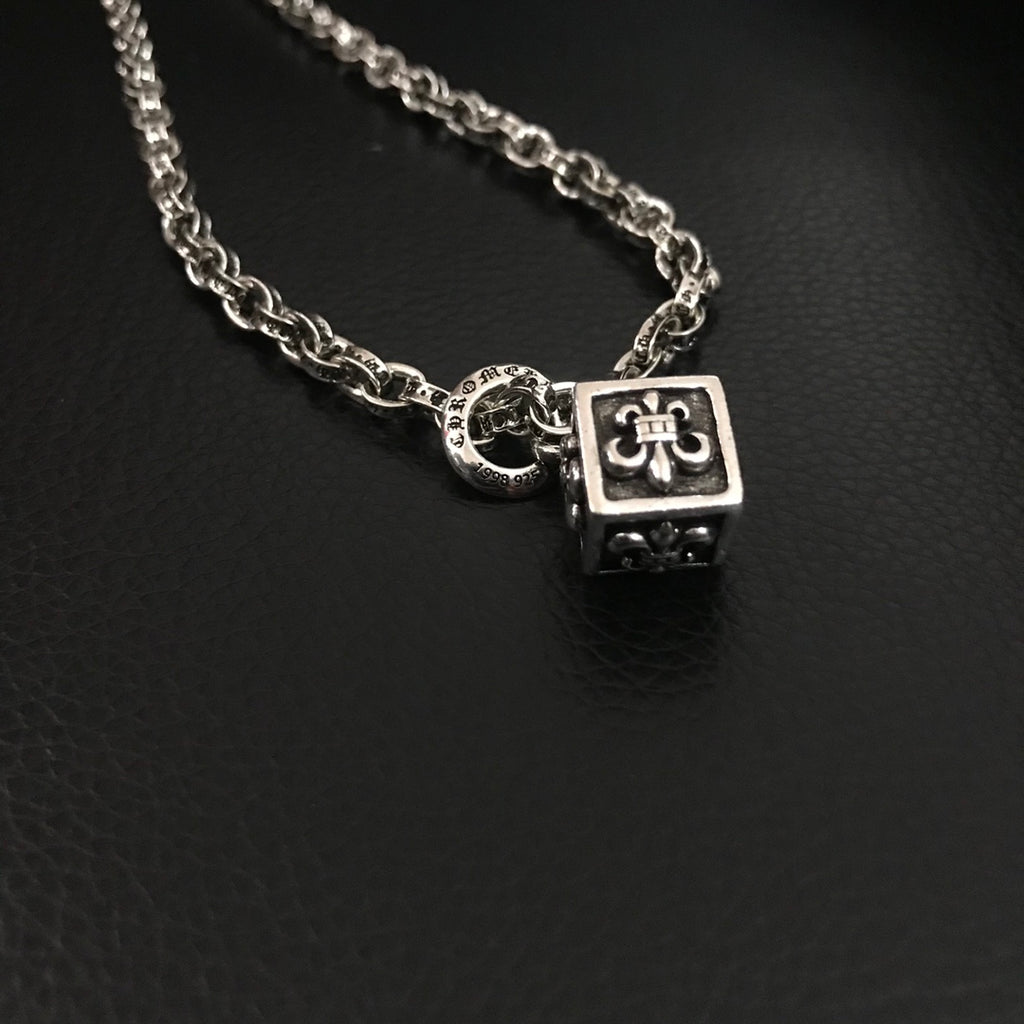 Silver-tone chain necklace with square pendant and circular link charm