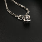 Silver-tone chain necklace with square pendant and circular link charm