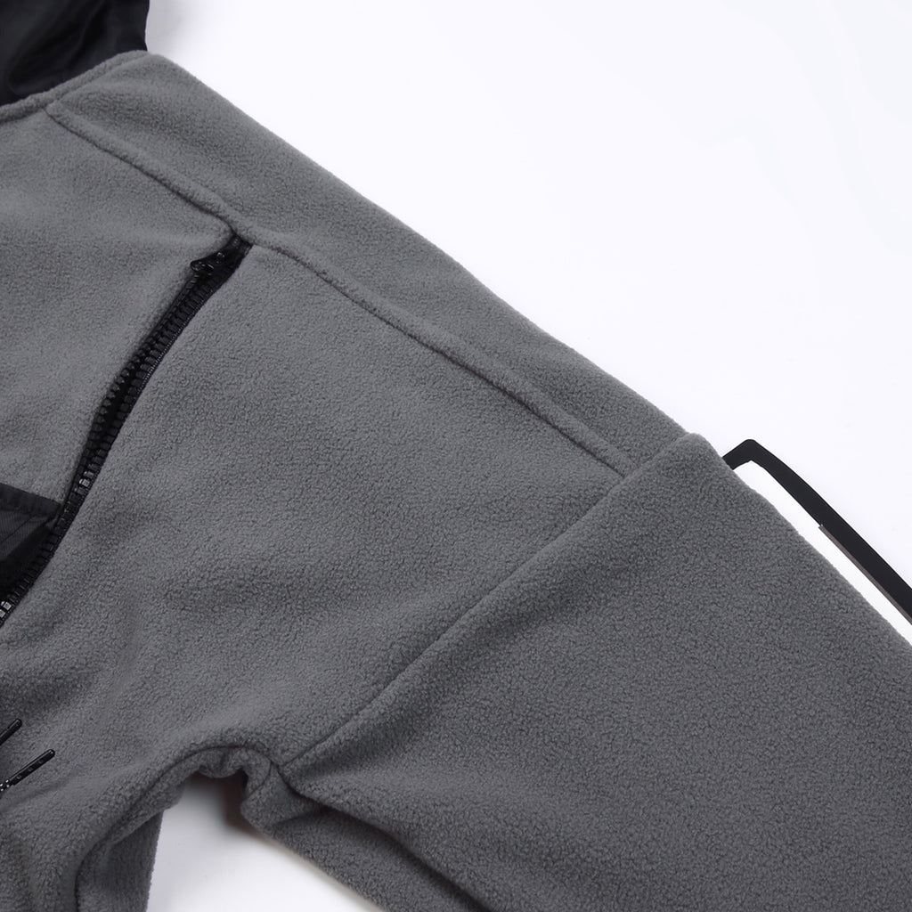 Stone Island jacket sleeve close-up, gray fleece with black stitched trim