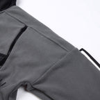 Stone Island jacket sleeve close-up, gray fleece with black stitched trim