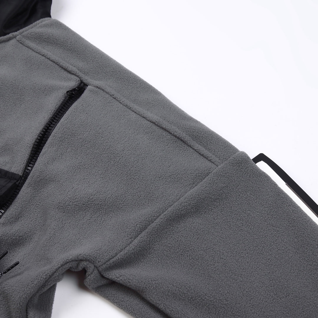 Stone Island jacket sleeve close-up, gray fleece with black stitched trim