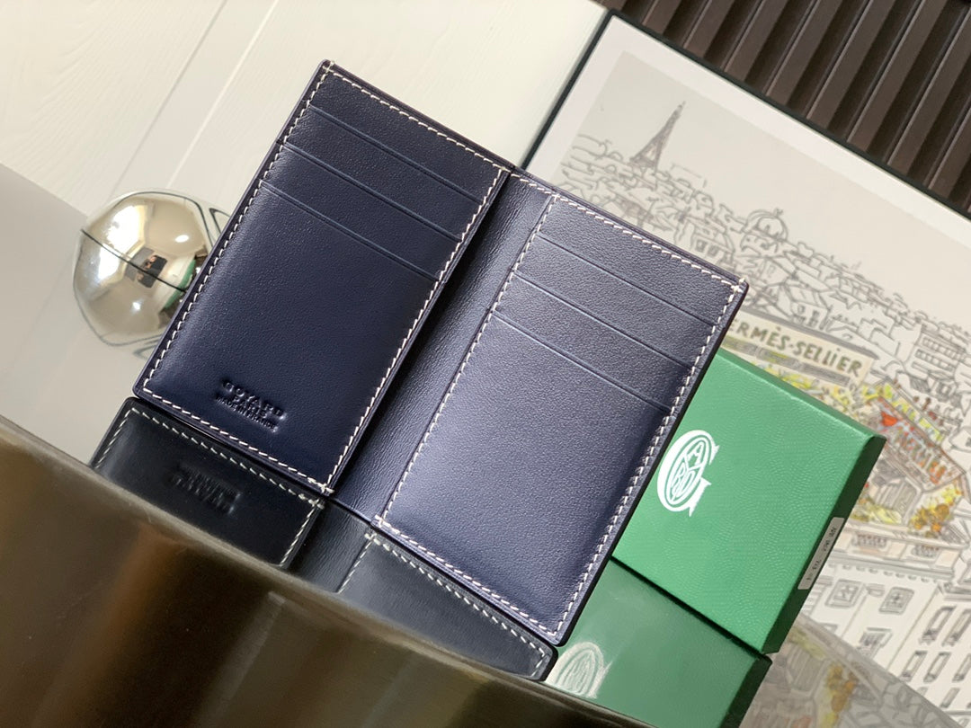 Small wallet with dark navy textured panels and visible card slots