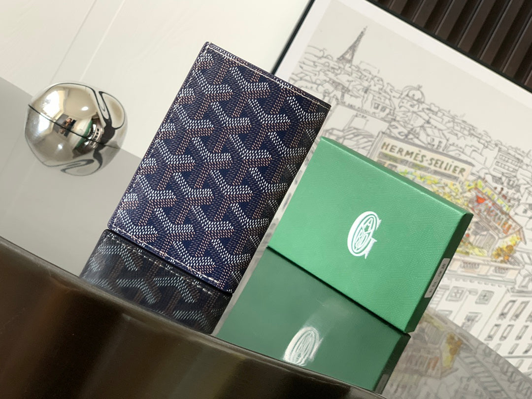Small cardholder-style bag with dark navy patterned surface and contrast border stitching