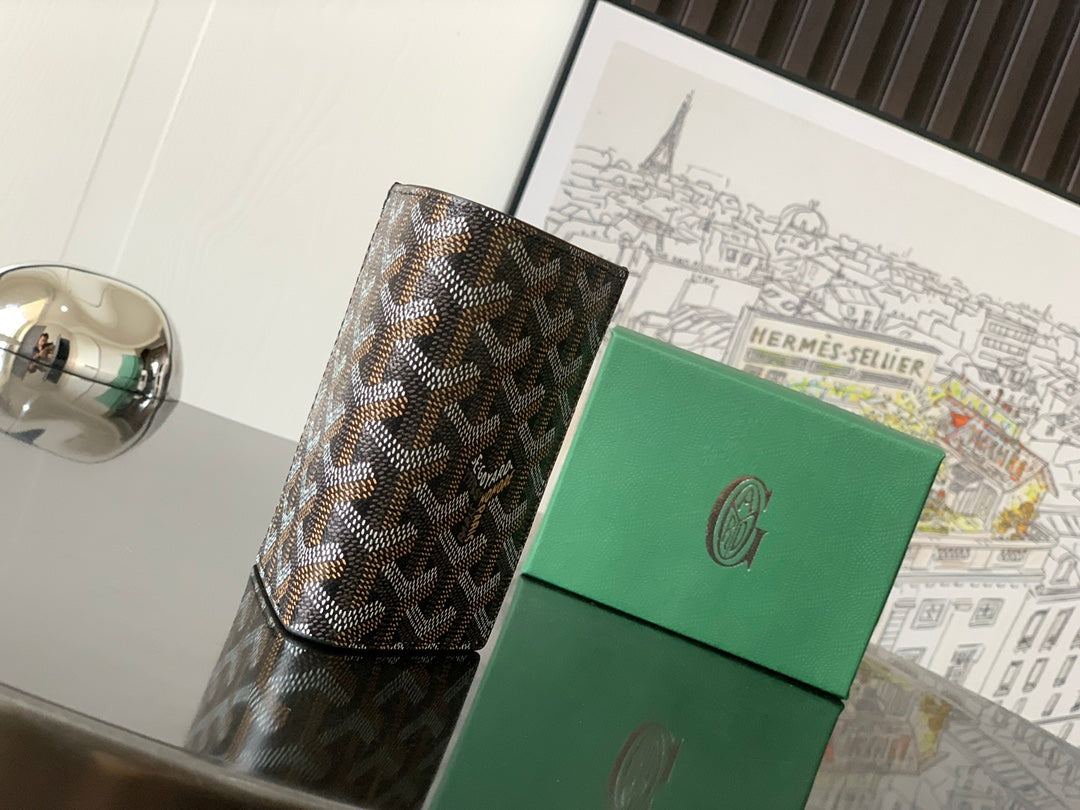 Goyard small bag in brown-and-beige geometric coated canvas with black trim and front closure