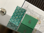 Green leather bag with teal patterned panel and double flap closure
