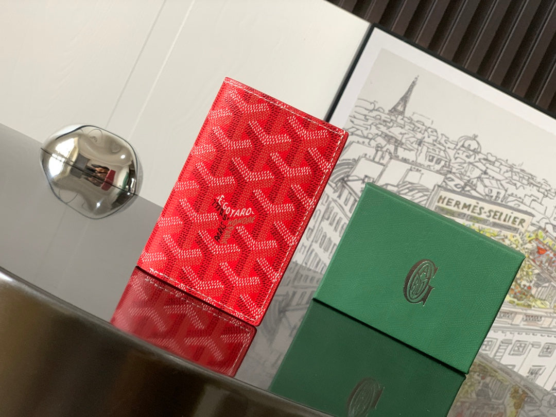 Goyard small wallets, front view: red patterned card case with green leather case