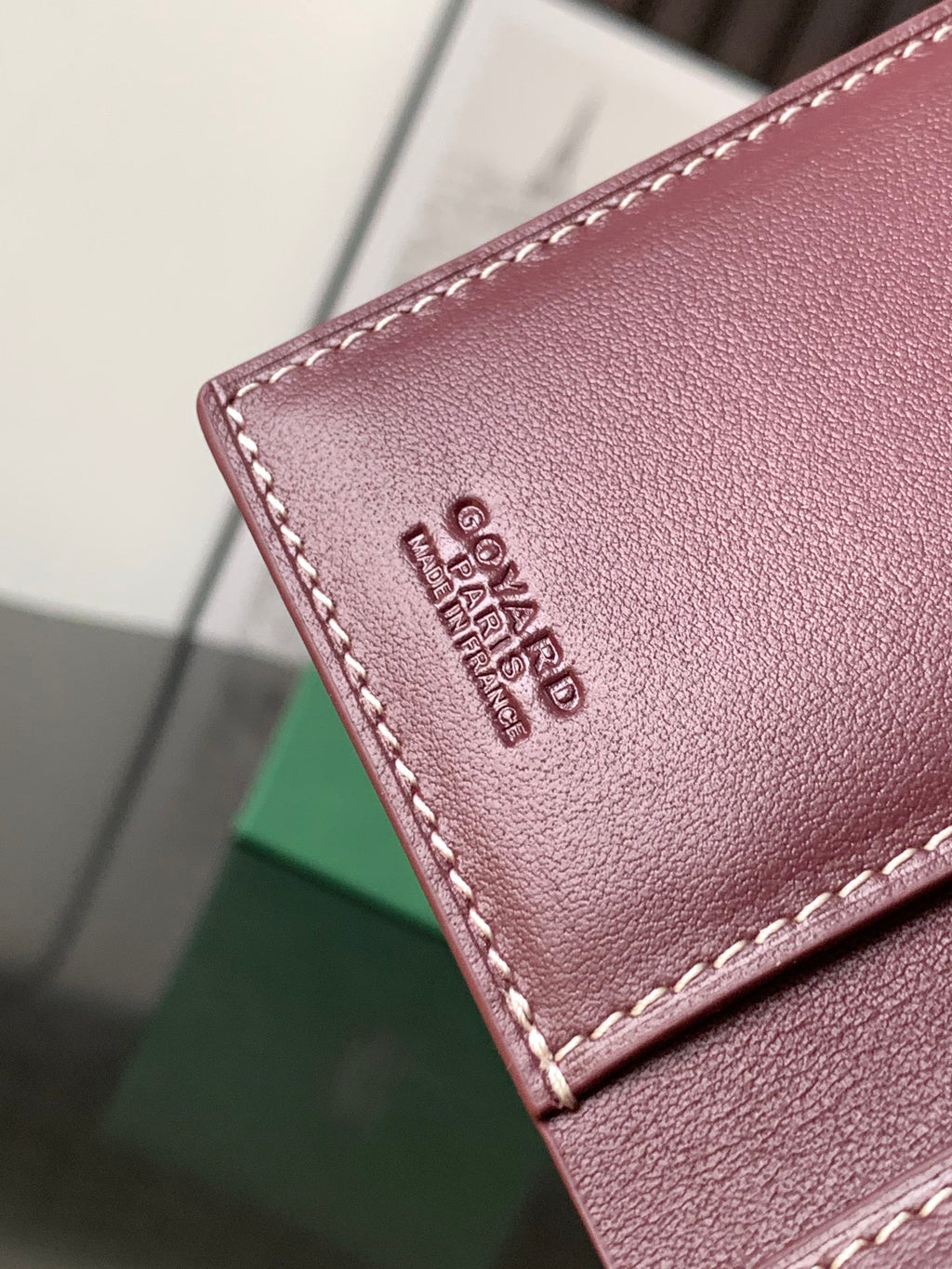 Maroon leather small bag with stitched edge and Goyard logo embossing