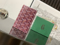 Burgundy patterned Goyard small bag with logo panel