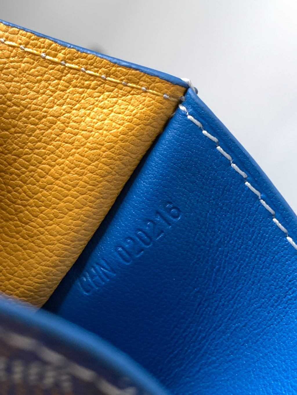 Goyard blue and yellow leather wallet interior with contrast stitched seam