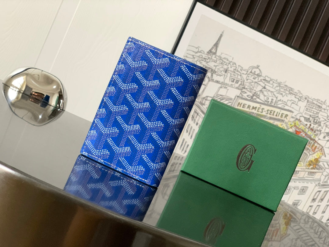 Goyard small bag, blue patterned leather with stitched flap and trim, side view