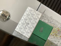Goyard bag with white monogram canvas and green leather panels