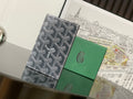 Goyard monogram wallet with dark trim and front seam.