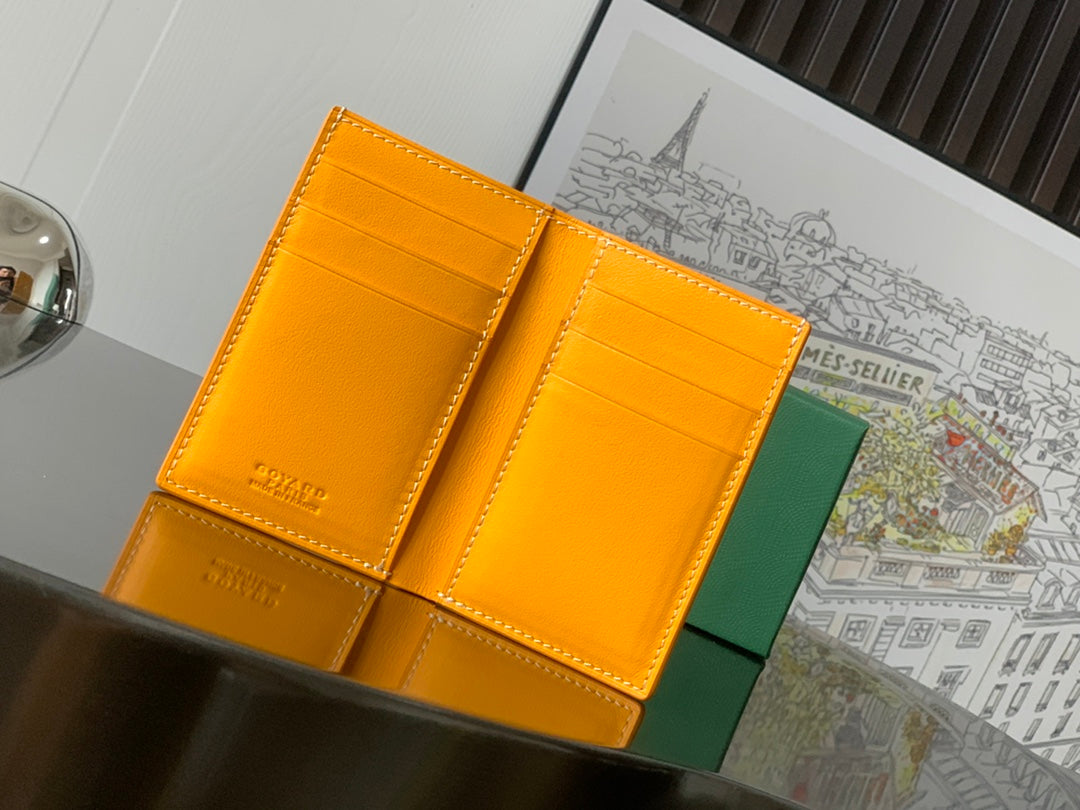 Orange leather Goyard card holder with multiple compartments and stitched edges