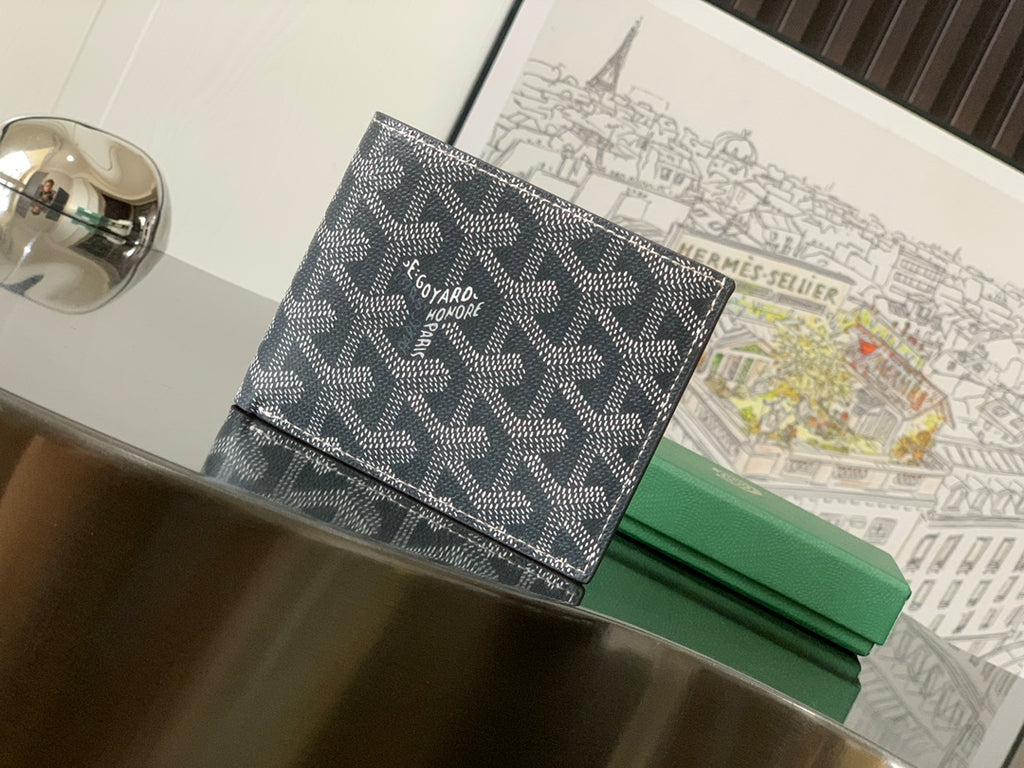 Goyard small bag with dark patterned canvas and leather trim, front flap closure