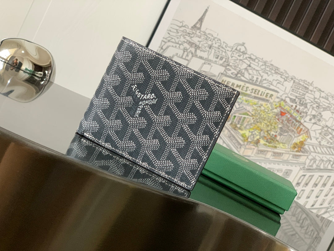 Goyard small bag with dark patterned canvas and leather trim, front flap closure