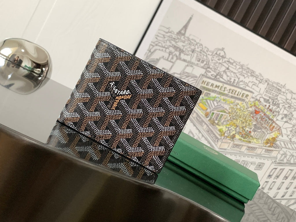 Small bag with dark patterned canvas front and clasp flap