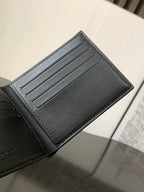 Leather card holder with card slots and edge stitching on dark interior