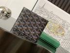 Small bag with patterned canvas exterior and stitched flap edge