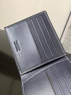 Goyard bag interior card slots with smooth blue leather and stitched border