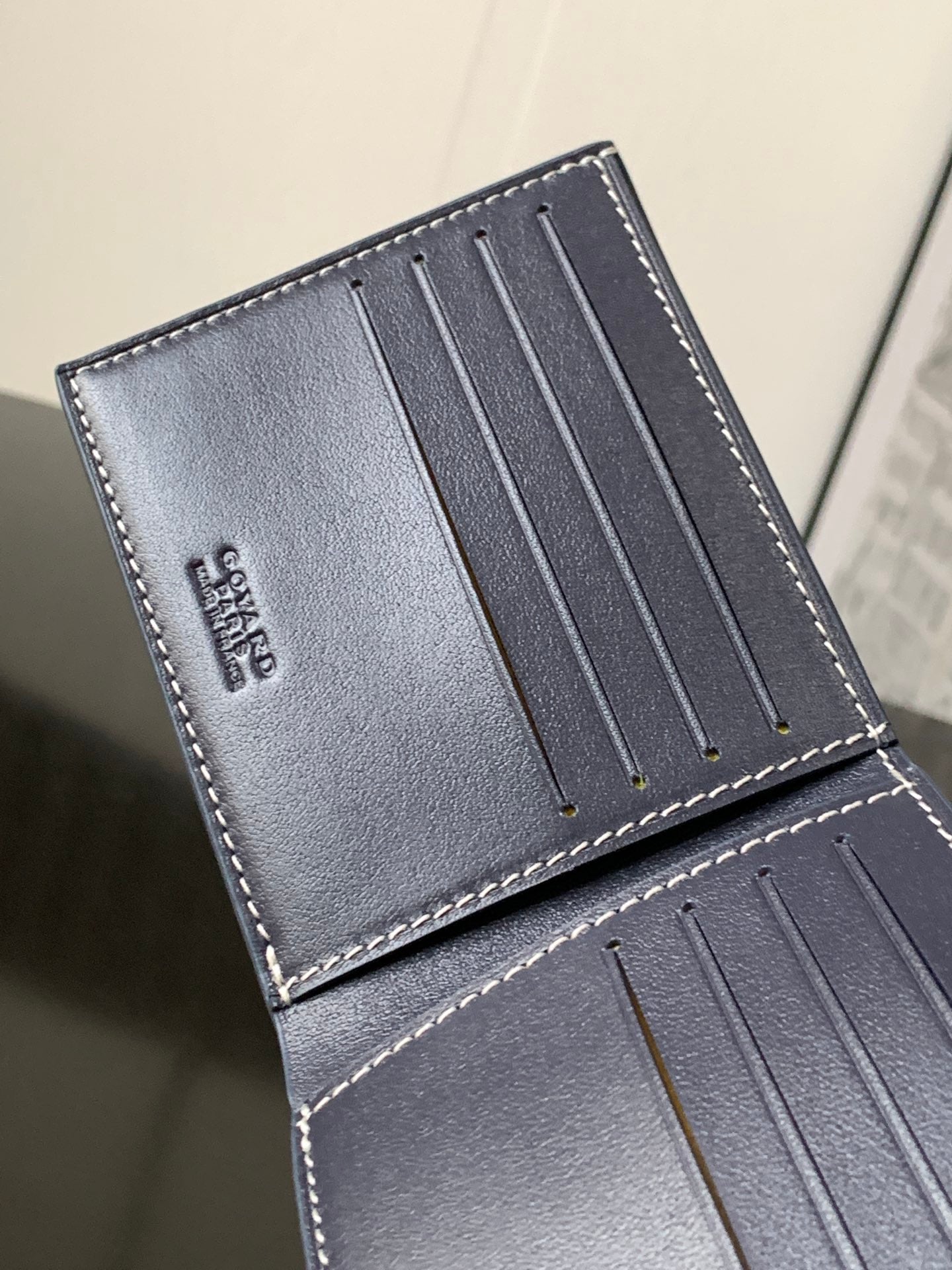 Goyard bag interior card slots with smooth blue leather and stitched border
