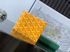 Goyard small bag, yellow patterned canvas with logo detail