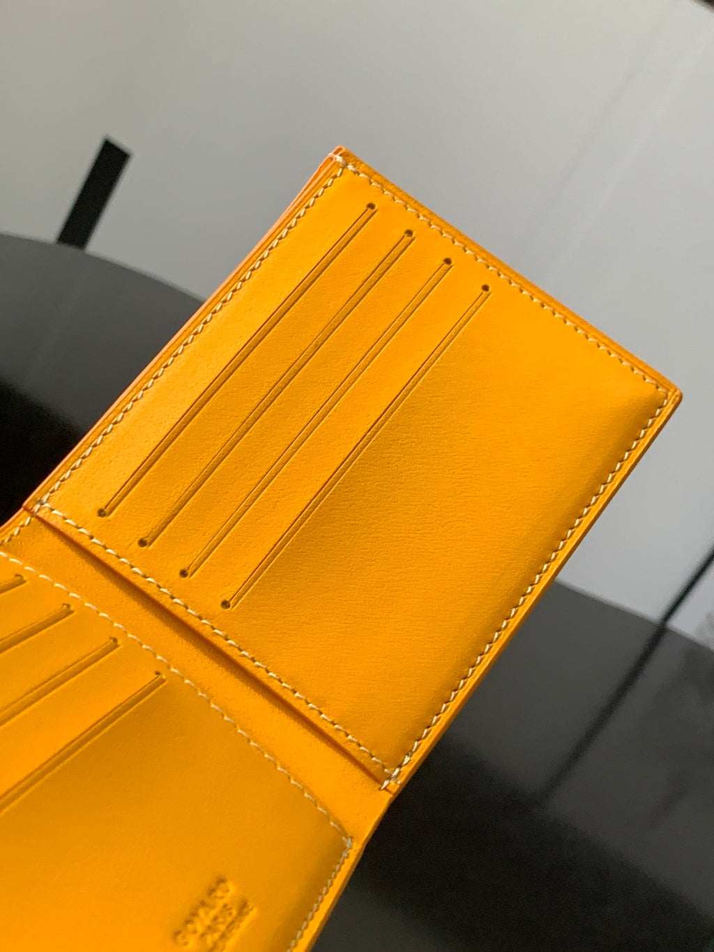 Goyard yellow leather card holder with stitched corner and three interior slots
