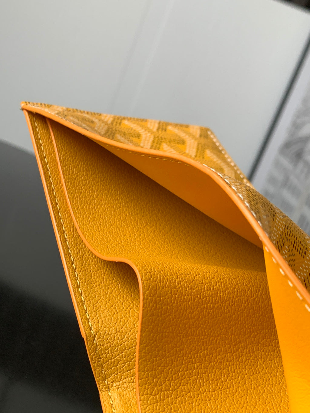 Goyard yellow leather bag interior with curved card pocket and smooth lining