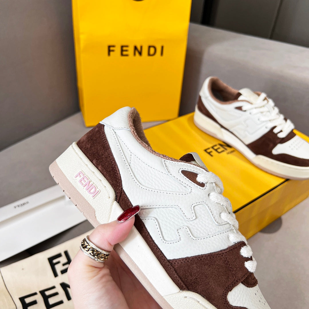 Unisex Fendi sneakers close-up, white leather with dark brown suede heel and side accents