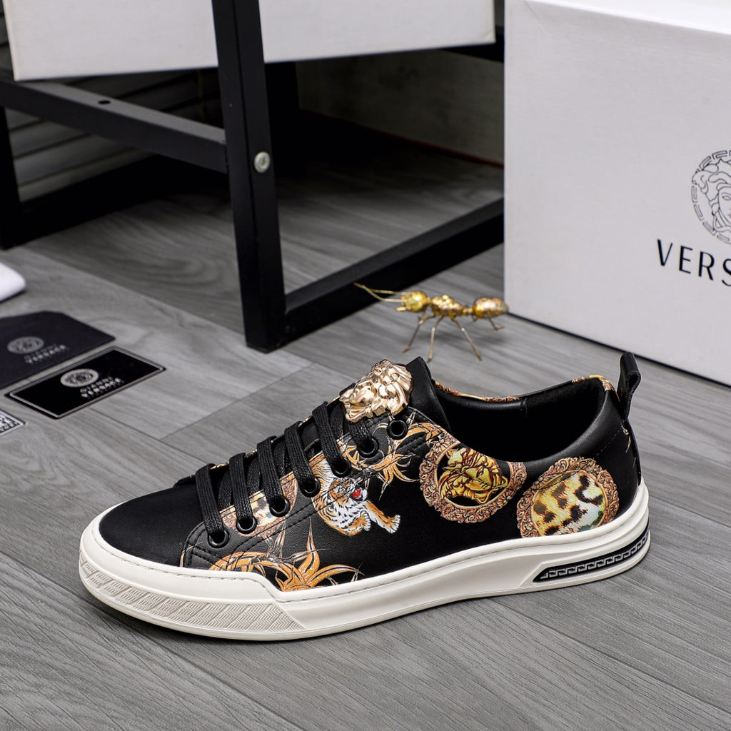 Black low-top sneakers with leopard and tiger print accents, white rubber sole
