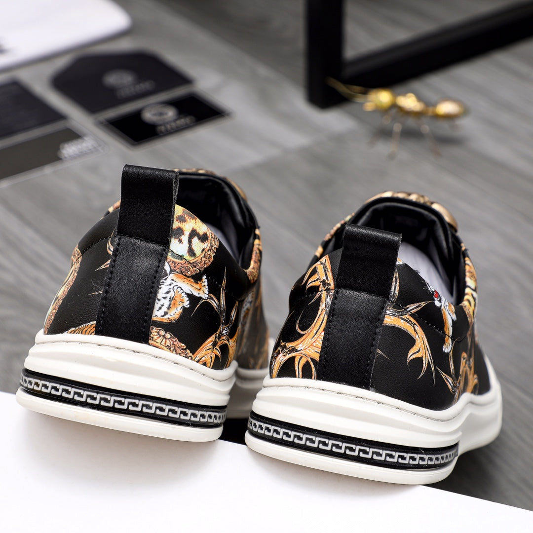 Back view black sneakers with gold animal print and white rubber sole