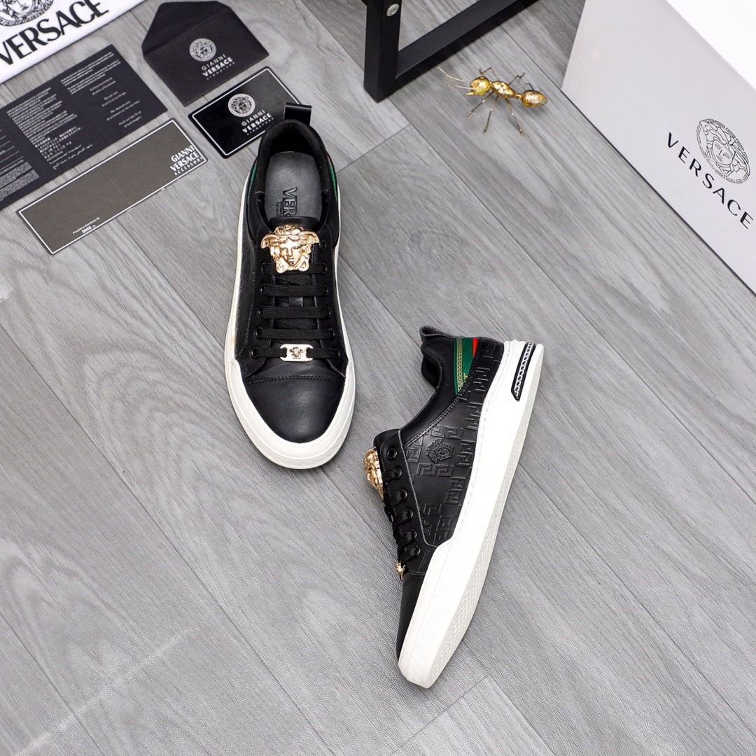 Versace black low-top sneakers with gold crest lace tips, green/red side stripe, white sole