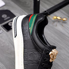 Versace black low-top sneaker side view, green/red stripe and gold crest emblem