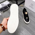 Versace sneaker outsole and heel, white rubber traction sole under black upper