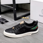 Versace black low-top sneakers, gold crest accents, green/red side stripe, white sole