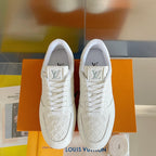 White lace-up sneakers with embossed LV logos on tongues, viewed from front.